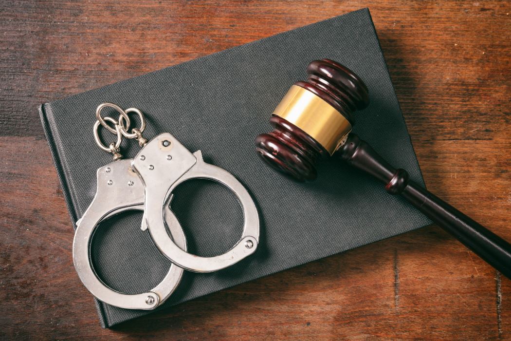 handcuffs-gavel-on-book-on-a-wooden-background-7msxj86-min.jpg