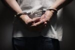 criminal-in-handcuffs-PTNKNY4-min-scaled-e1677843432903.jpg